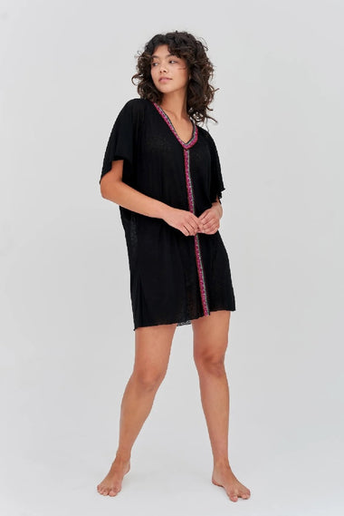 Model wearing black mini beach kaftan