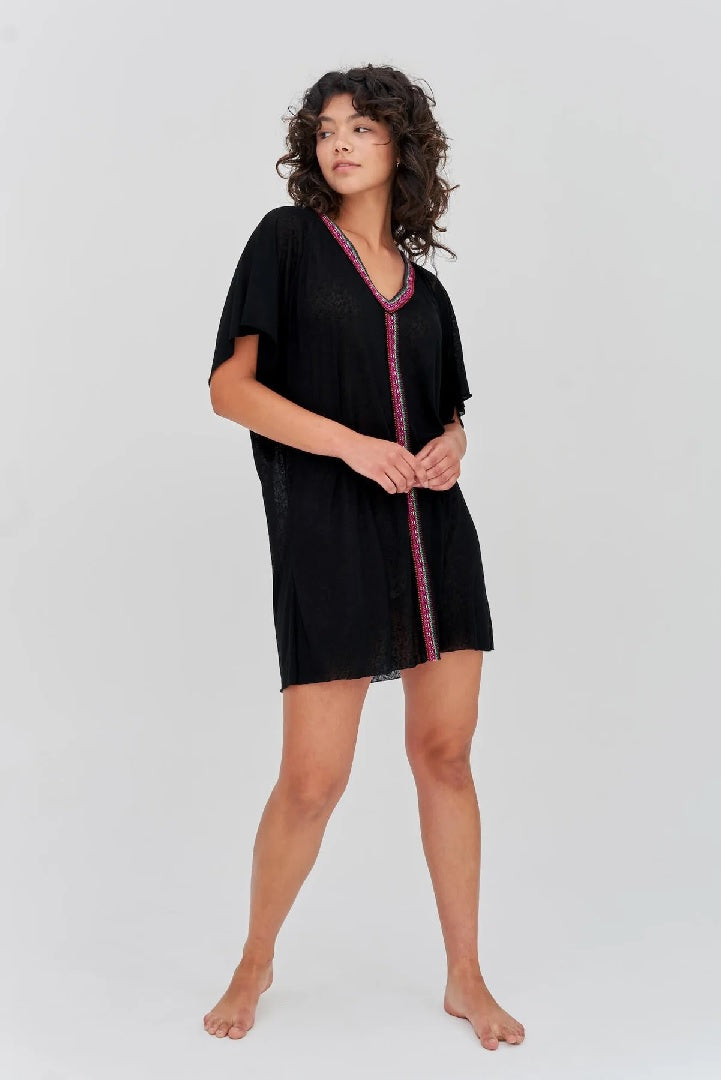 Model wearing black mini beach kaftan