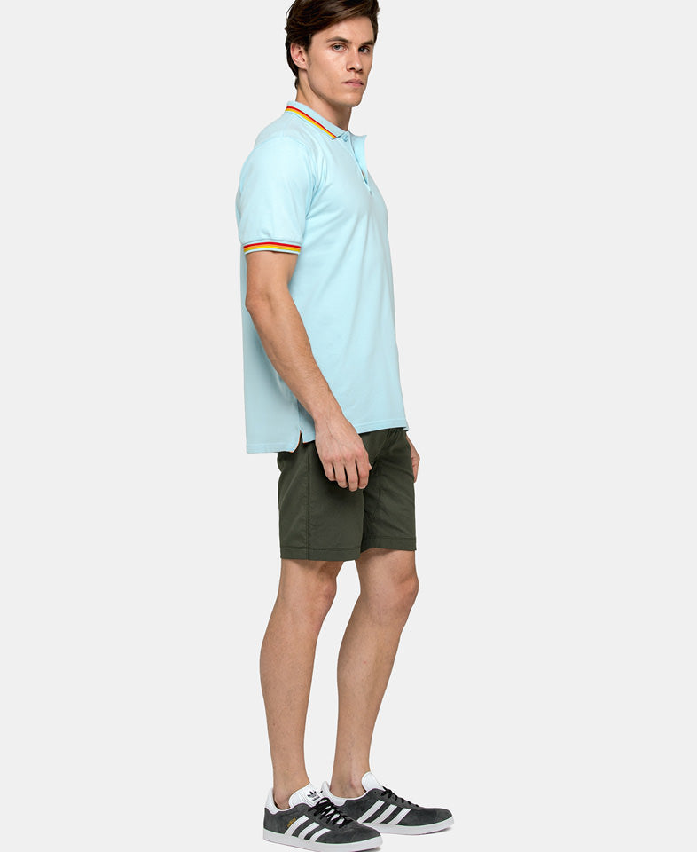 man wearing a baby blue mens polo