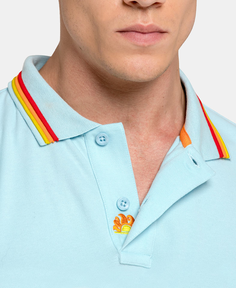 man wearing a light blue mens polo shirt