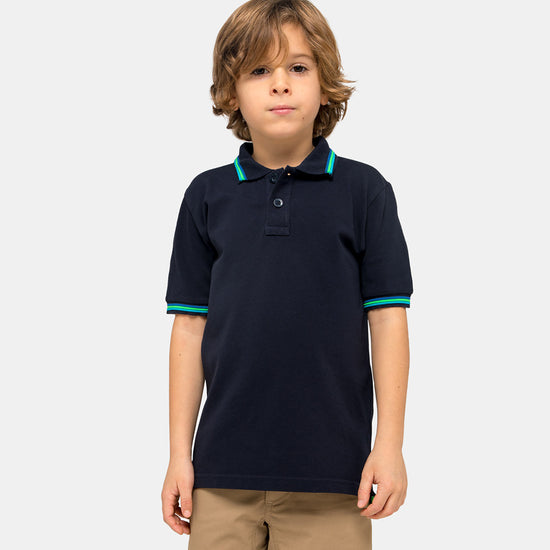 boy wearing a navy blue polo shirt
