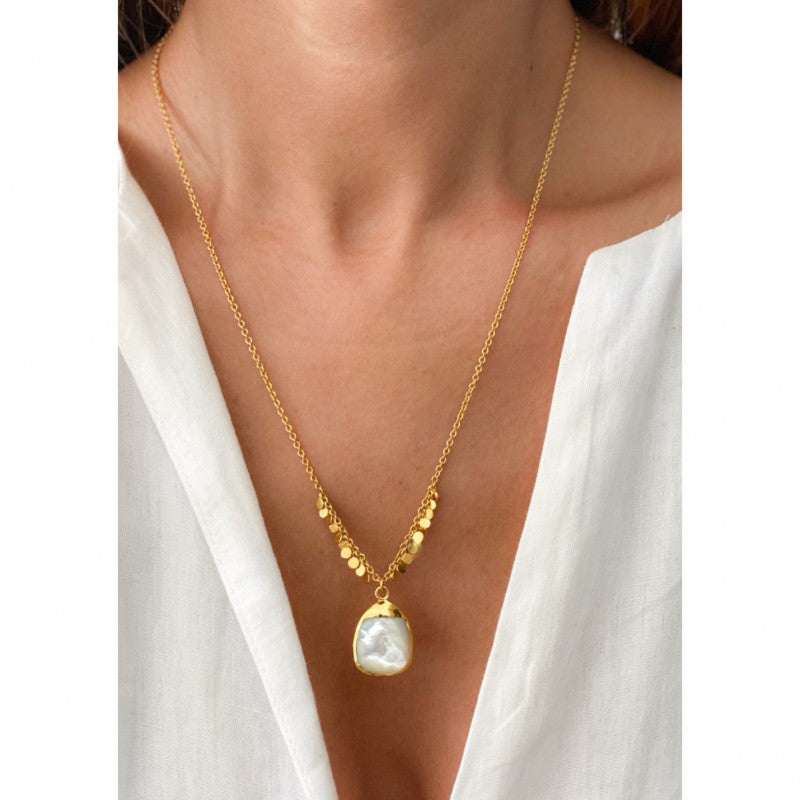 Graceful woman donning Mother of Pearl Necklace by Sara Lashay