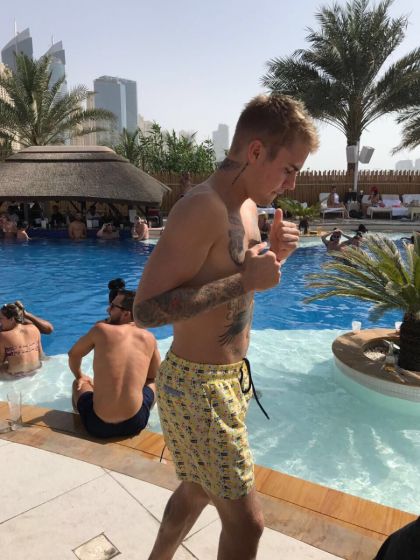 Justin Bieber Wearing Mens Yellow Board Shorts
