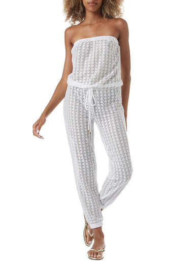 Woman wearing white sleeveless jumpsuit by Melissa Odabash