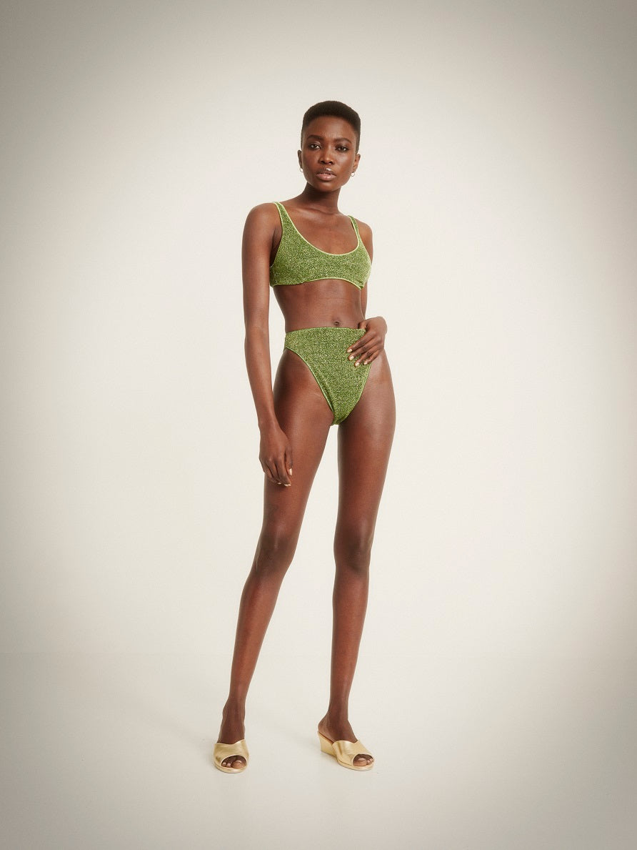 woman wearing an emerald green bikini