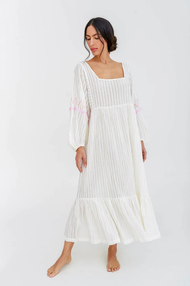 Woman gracefully adorning the Boho Chic White Midi Dress