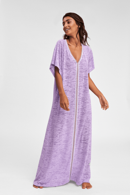 Woman donning Pitusa Lilac Beach Cover Up
