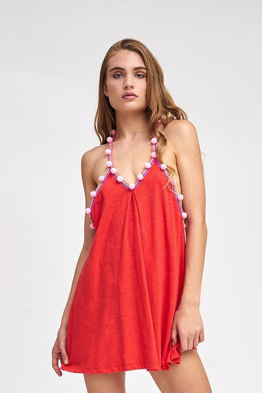 Woman showcasing Pom Pom Dress Blood Orange