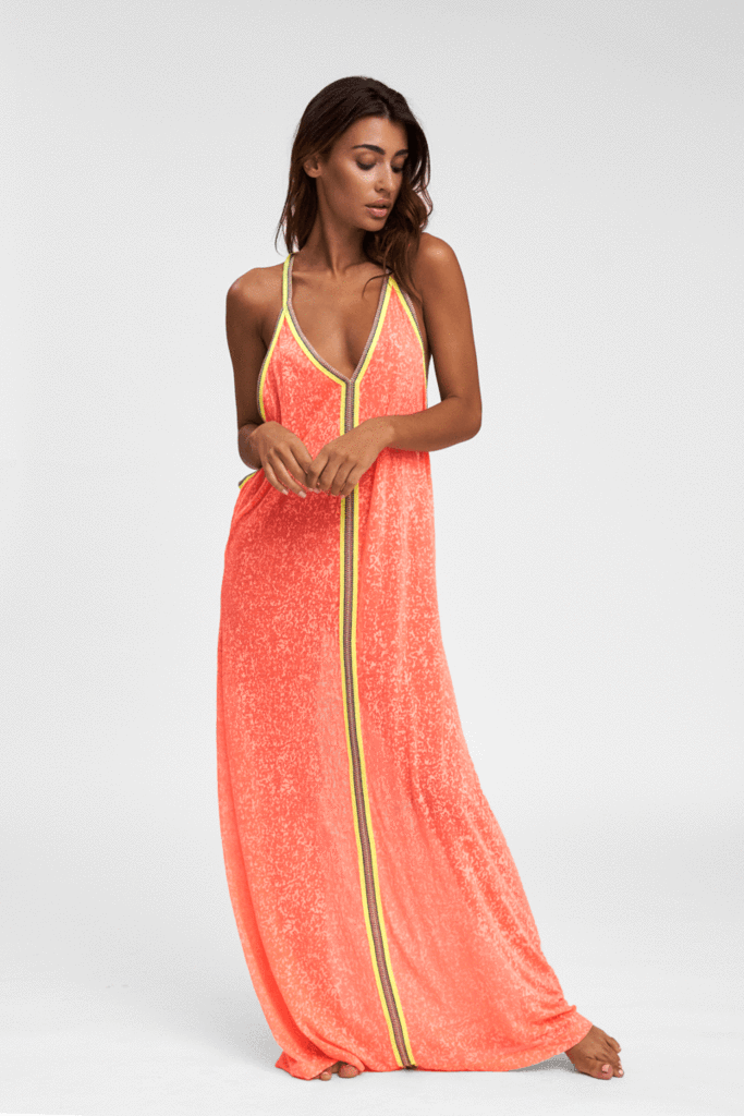 Woman sporting the Inca Sundress Watermelon Pink/Orange light orange beach dress