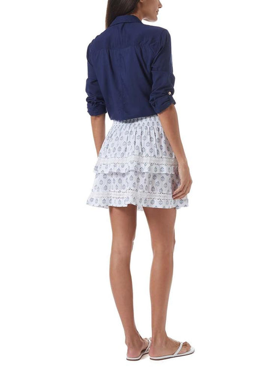 Woman flaunting white Aztec Barbara mini skirt