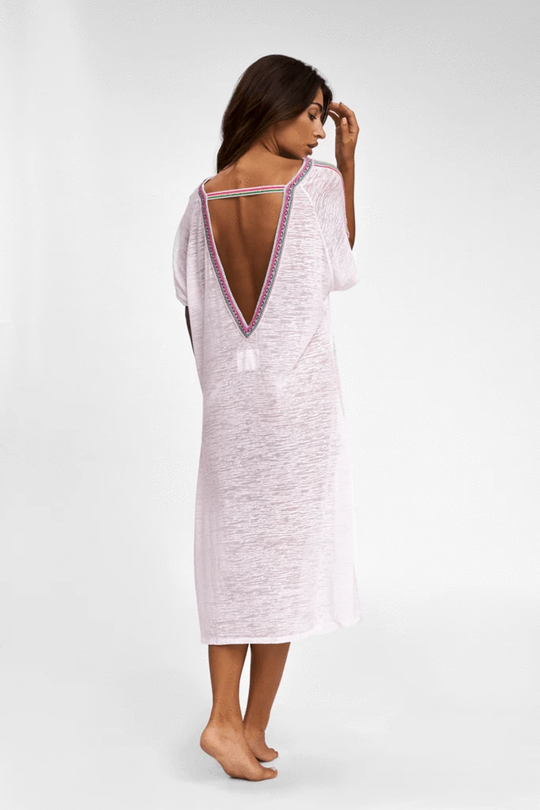 Woman showcasing V Back Dress in White