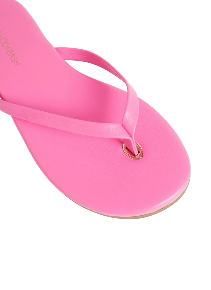 Close-up of Hot Pink Leather Flip Flop with Gold Embellishment